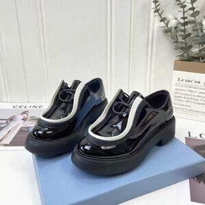 Prada Glossy Black and White Loafers
